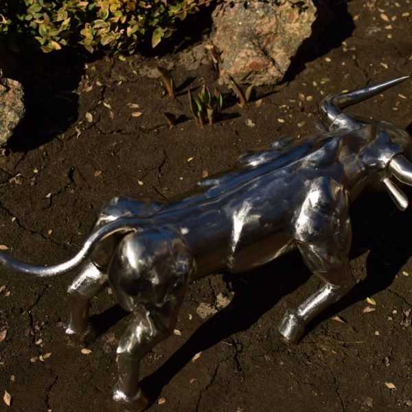 Small geometric bull sculpture in polished stainless steel