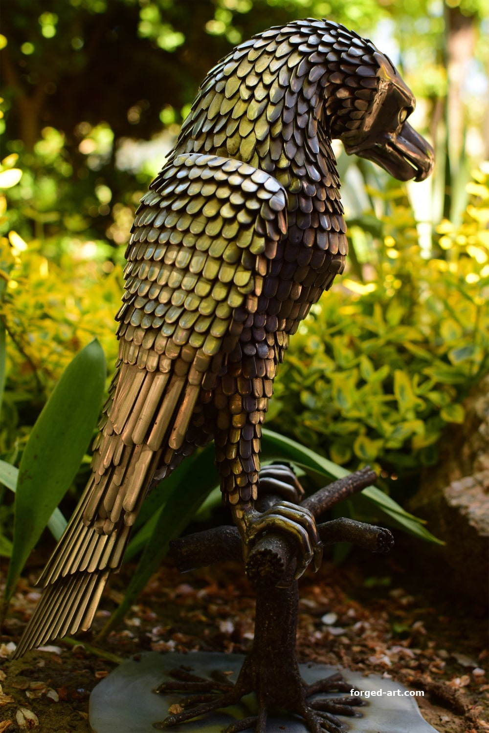 An eagle sitting on a tree - a beautiful sculpture made of stainless steel - photo 3